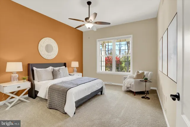 a living room with furniture kitchen view and a chandelier