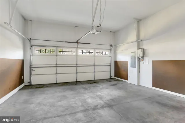 a view of empty room with a fireplace and cabinet