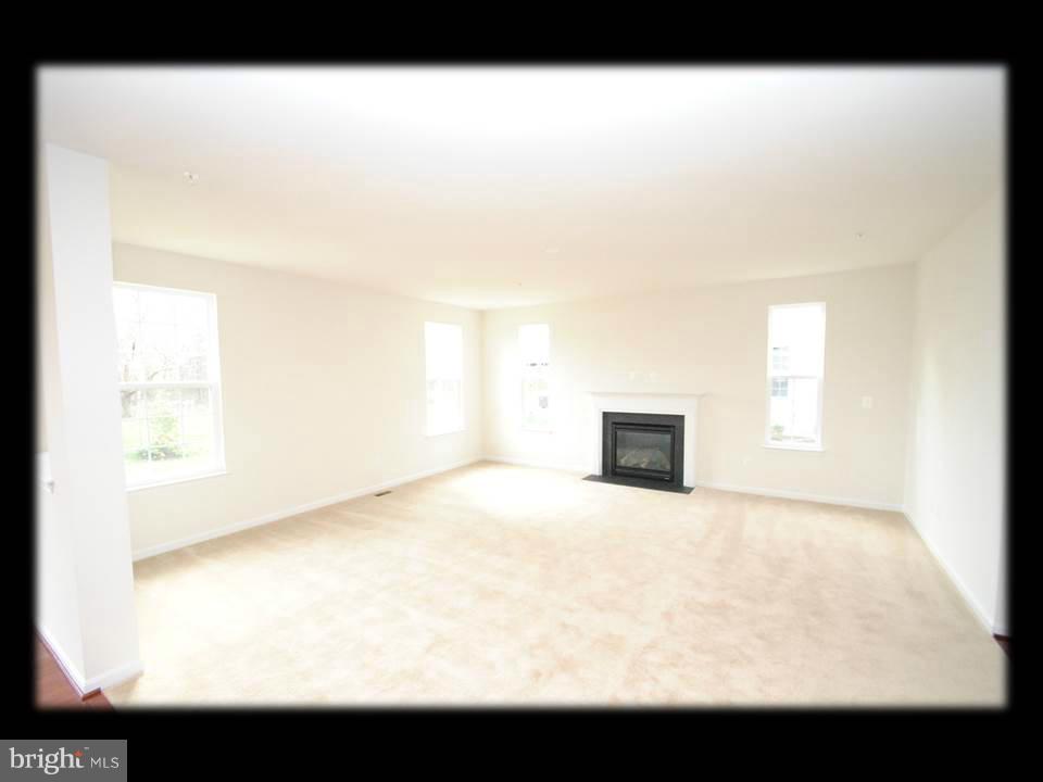 813 Wampler Road Baltimore, MD 21220 - Photo 11 of 30 a view of empty room with wooden floor
