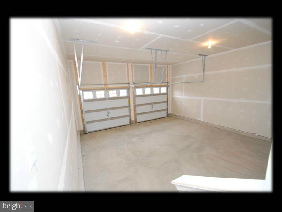 813 Wampler Road Baltimore, MD 21220 - Photo 17 of 30 a view of a room with racks on the wall