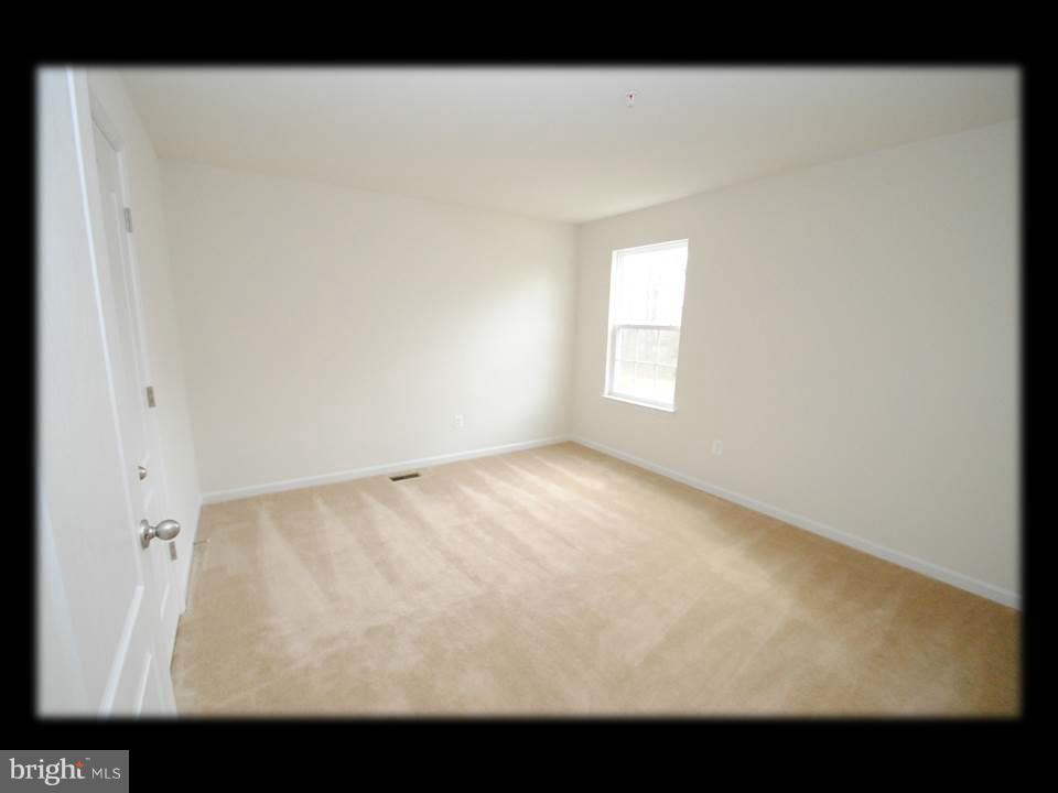813 Wampler Road Baltimore, MD 21220 - Photo 24 of 30 a view of an empty room and window