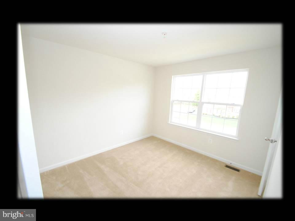813 Wampler Road Baltimore, MD 21220 - Photo 25 of 30 a view of an empty room with a window