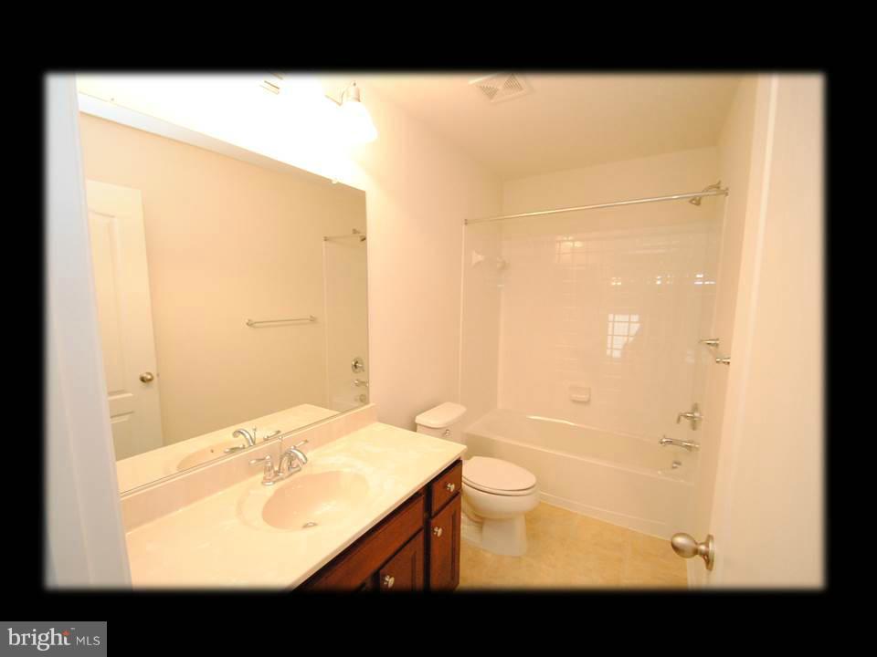 813 Wampler Road Baltimore, MD 21220 - Photo 28 of 30 a bathroom with a sink a toilet and shower