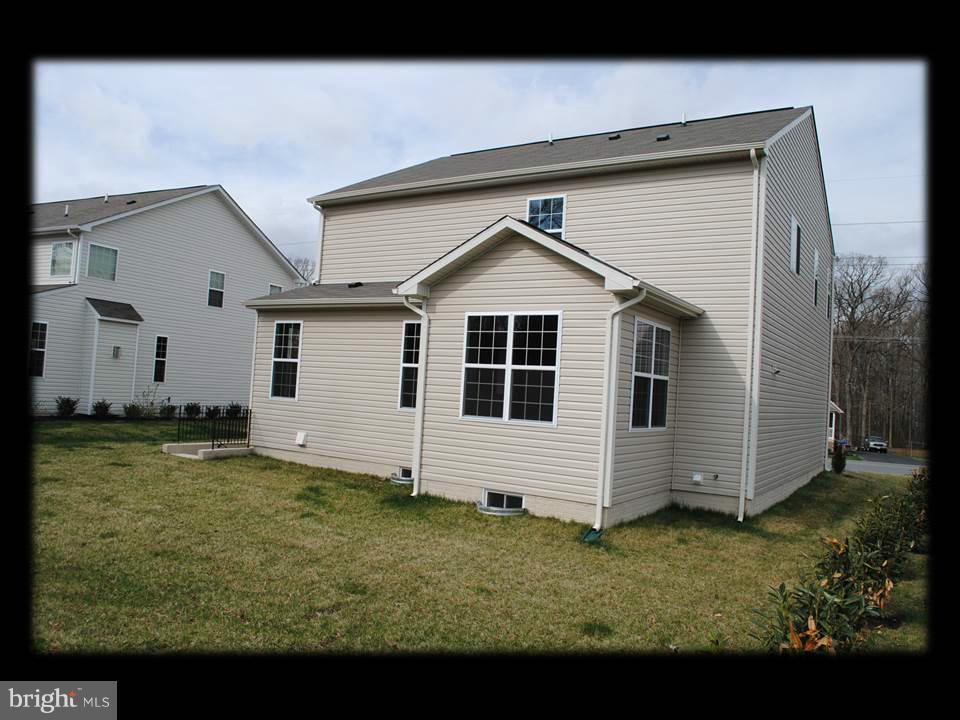 813 Wampler Road Baltimore, MD 21220 - Photo 4 of 30 a view of a house with a yard