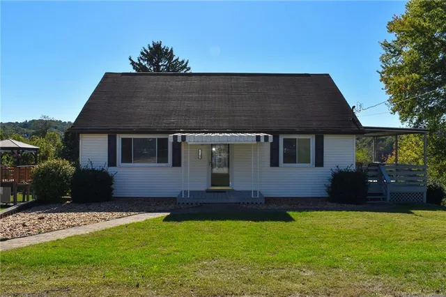 a front view of a house with a yard