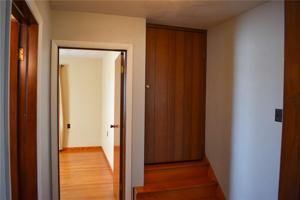 1149 Highland Avenue Vandergrift, PA 15690 - Photo 15 of 41 a view of a hallway with wooden floor