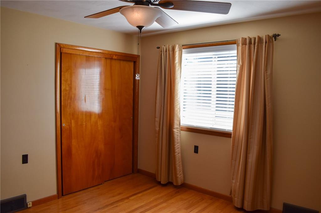 1149 Highland Avenue Vandergrift, PA 15690 - Photo 17 of 41 a view of an empty room with wooden floor and a window