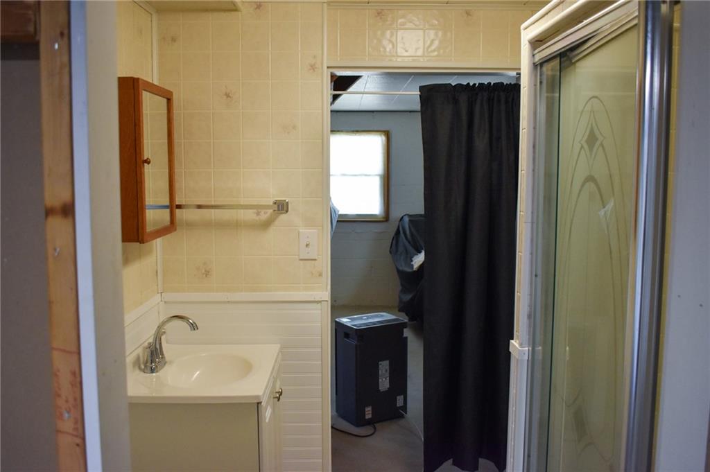 1149 Highland Avenue Vandergrift, PA 15690 - Photo 27 of 41 a bathroom with a sink a toilet and shower