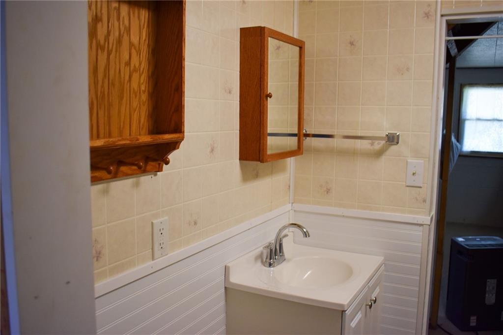 1149 Highland Avenue Vandergrift, PA 15690 - Photo 28 of 41 a bathroom with a sink and a mirror