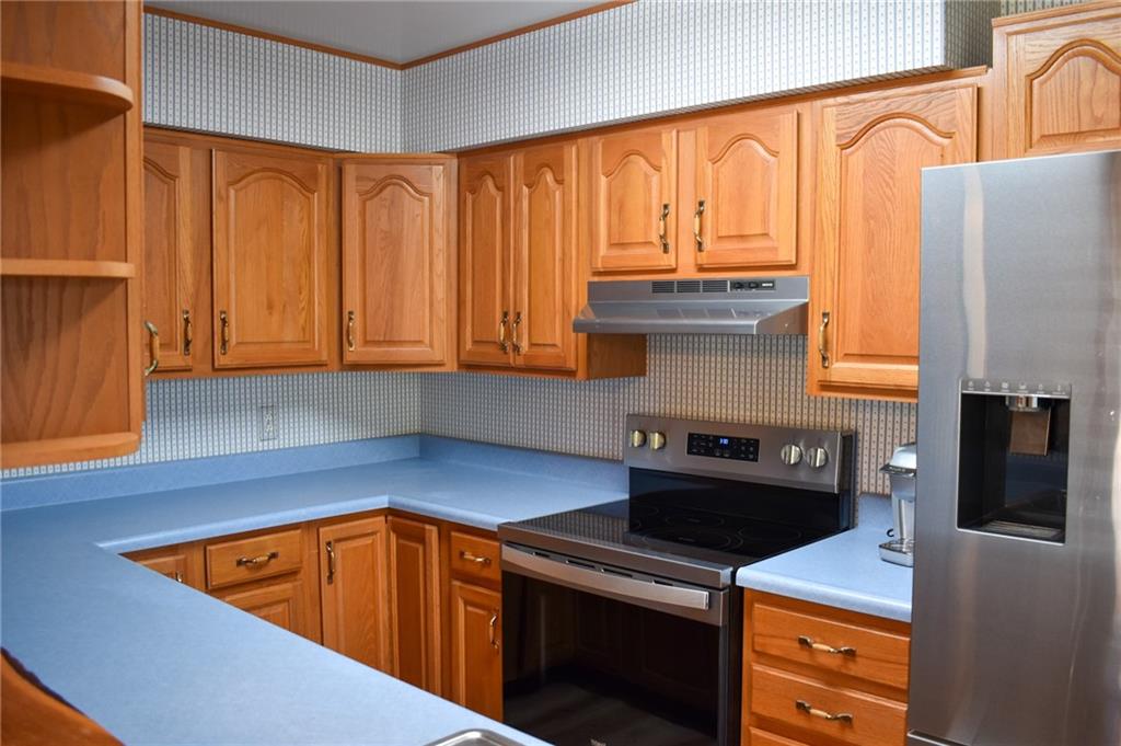1149 Highland Avenue Vandergrift, PA 15690 - Photo 8 of 41 a kitchen with stainless steel appliances granite countertop a stove a sink and dishwasher