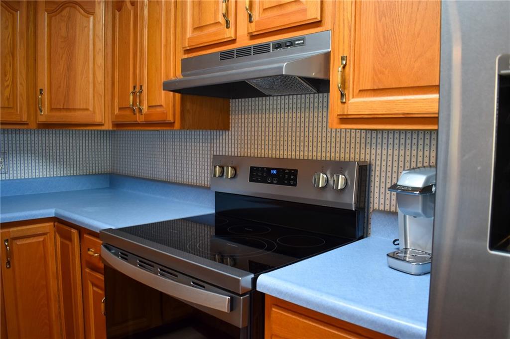 1149 Highland Avenue Vandergrift, PA 15690 - Photo 10 of 41 a kitchen with a stove and a microwave