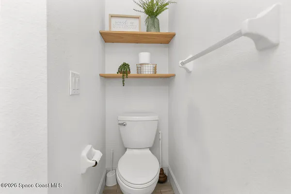 a bathroom with a toilet and a sink