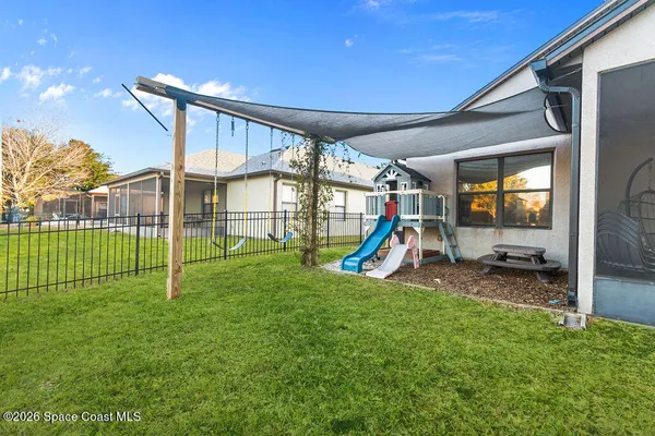 a view of a backyard with a slide