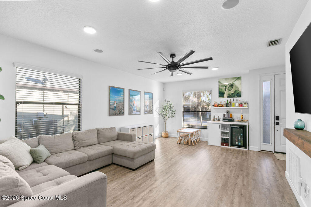 1209 Bolle Circle Rockledge, FL 32955 - Photo 9 of 28 a living room with furniture flat screen tv and window