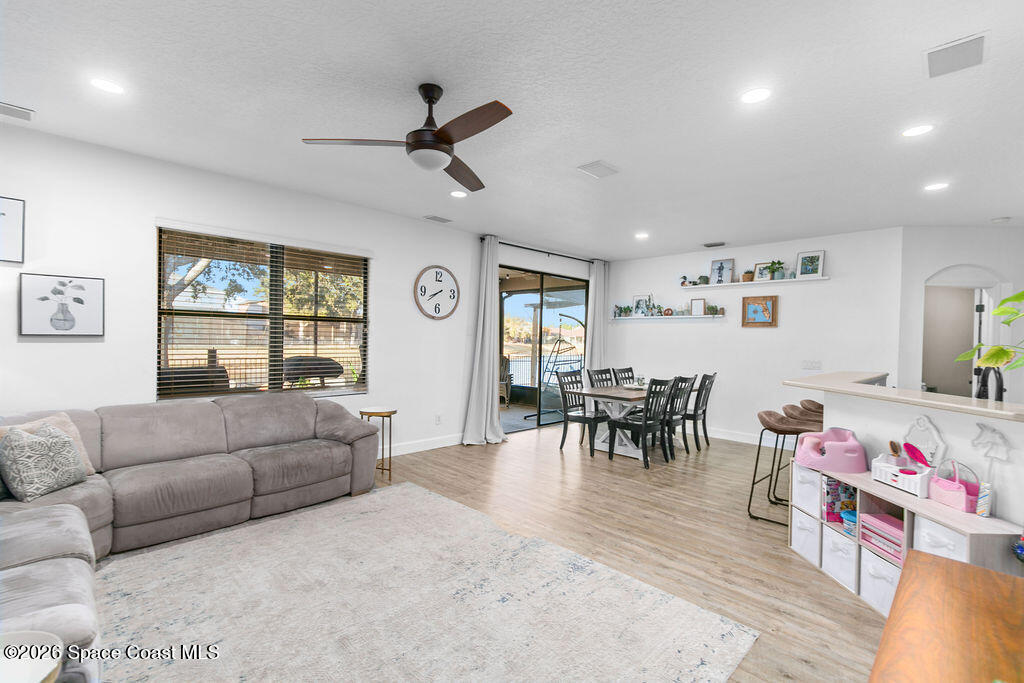 1209 Bolle Circle Rockledge, FL 32955 - Photo 10 of 28 a living room with furniture and a window
