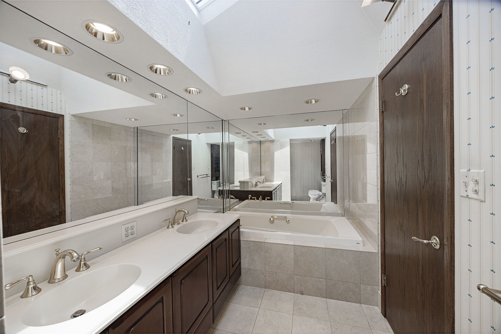 6723 Kingswood Road Willowbrook, IL 60527 - Photo 28 of 51 a large bathroom with a double vanity sink mirror and double