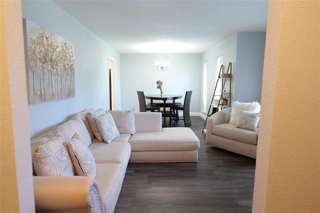 7137 Hunnicut Road Dallas, TX 75227 - Photo 8 of 16 Open-concept living area with wood-finish flooring, light-toned walls, and recessed lighting