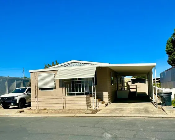 a view of a building with car parked