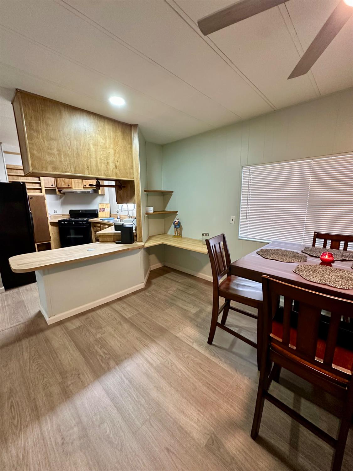 1200 South Carpenter Road, Unit 105 Modesto, CA 95351 - Photo 11 of 38 a living room with stainless steel appliances kitchen island granite countertop furniture a rug and a kitchen island