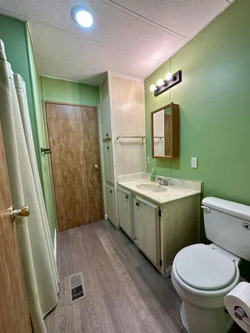 a view of a room with air conditioner and windows