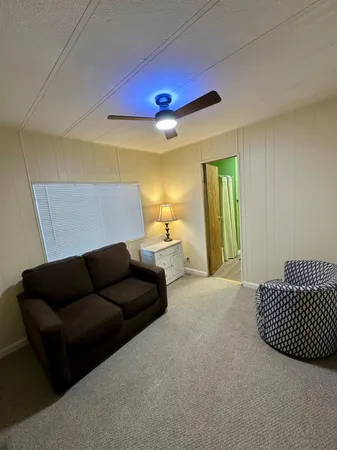 a bedroom with a bed and painted walls