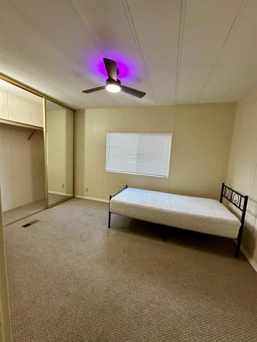 a view of a big room with air conditioner duct and materials on floor