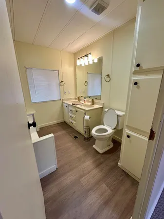 a view of a livingroom with workspace and a window