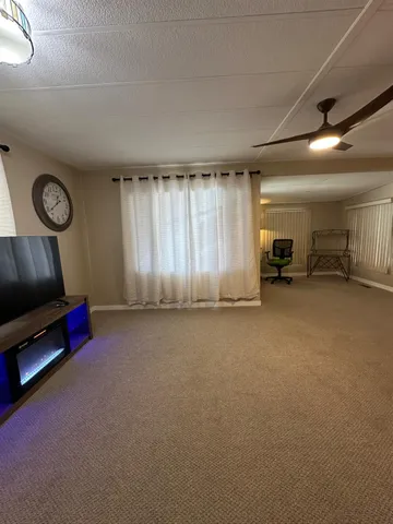 a view of a livingroom with a staircase