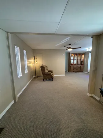 a swimming pool with outdoor seating and yard