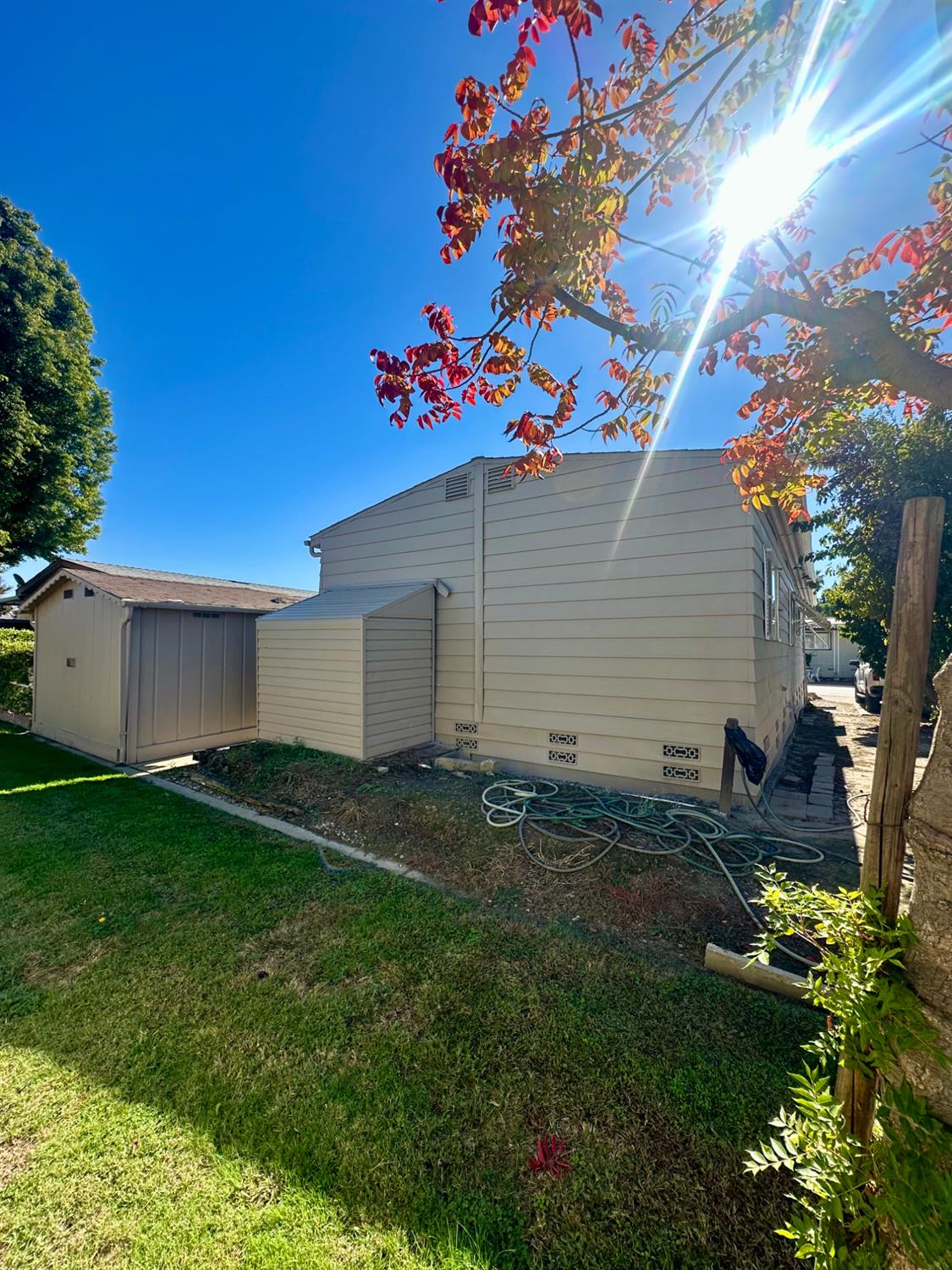 1200 South Carpenter Road, Unit 105 Modesto, CA 95351 - Photo 33 of 38 a backyard of a house with lots of green space