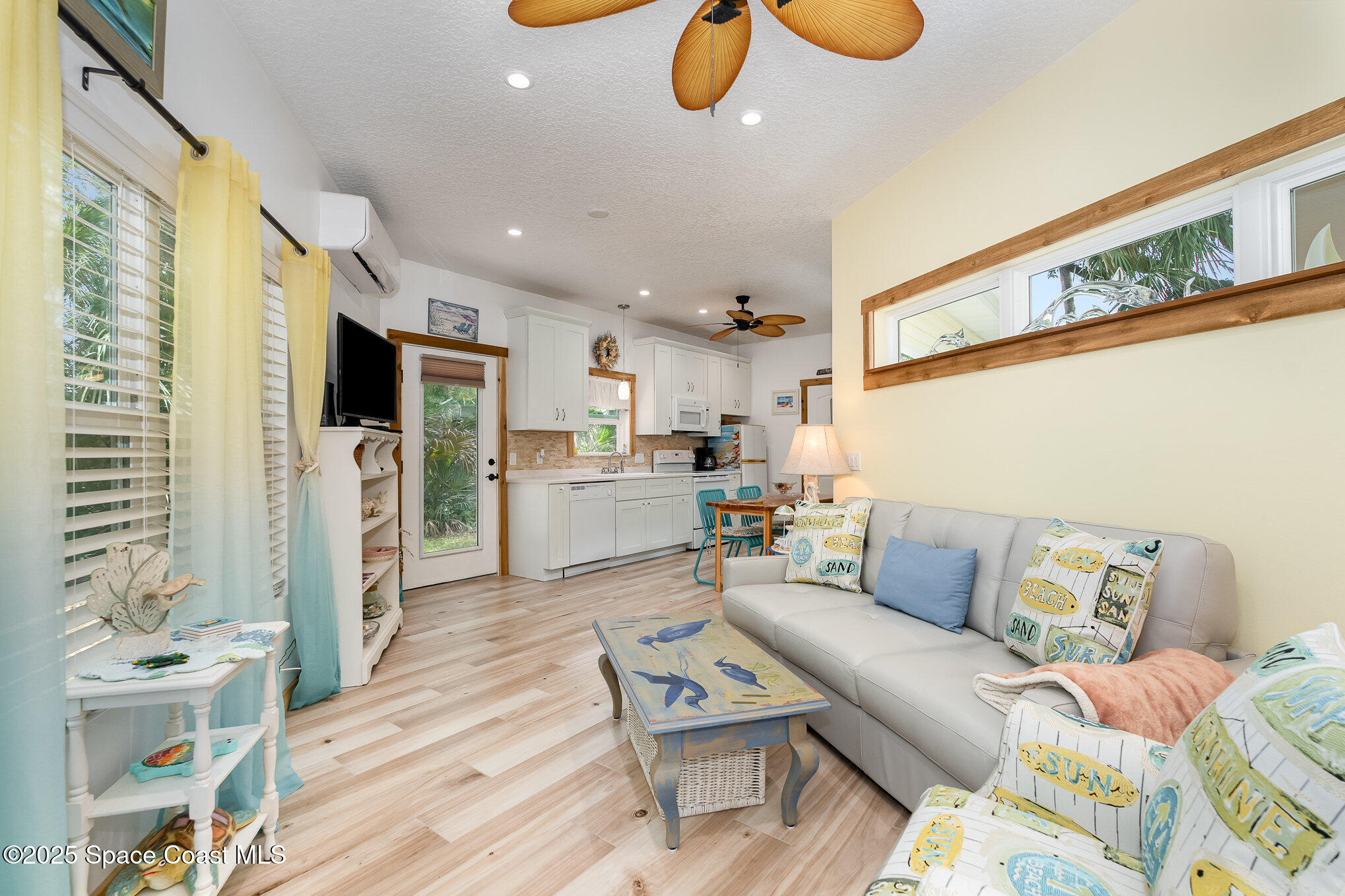 367 Oak Cove Road Titusville, FL 32780 - Photo 12 of 15 a living room with furniture and a table