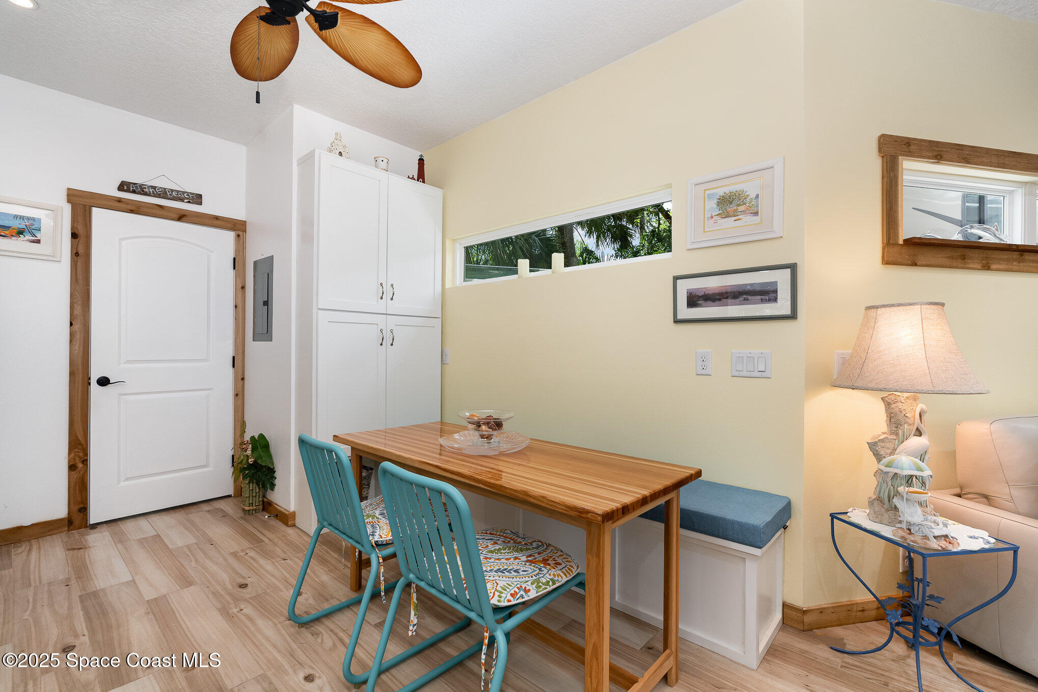 367 Oak Cove Road Titusville, FL 32780 - Photo 13 of 15 a view of a dining room with furniture and wooden floor
