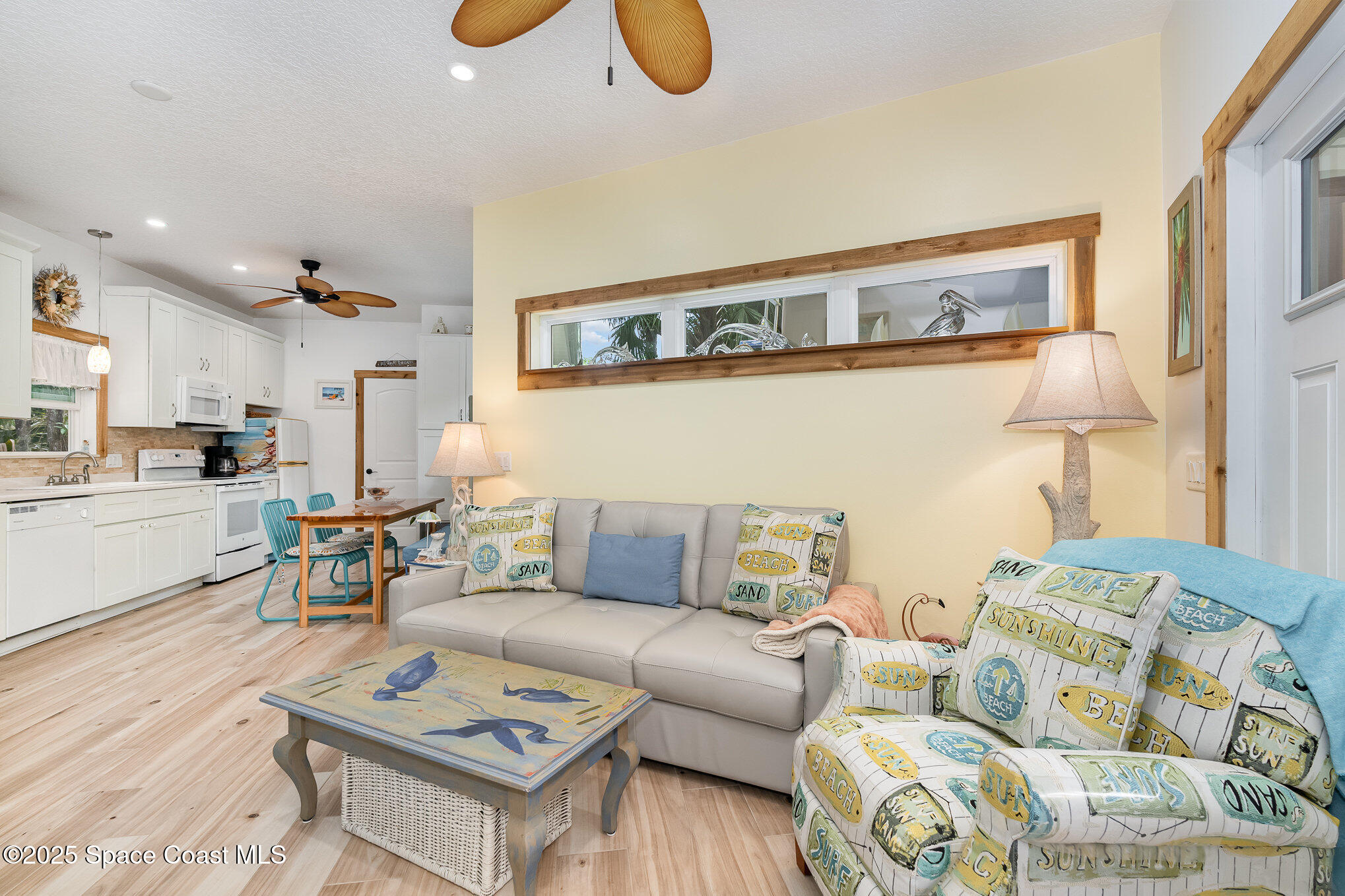 367 Oak Cove Road Titusville, FL 32780 - Photo 15 of 15 a living room with furniture and kitchen view