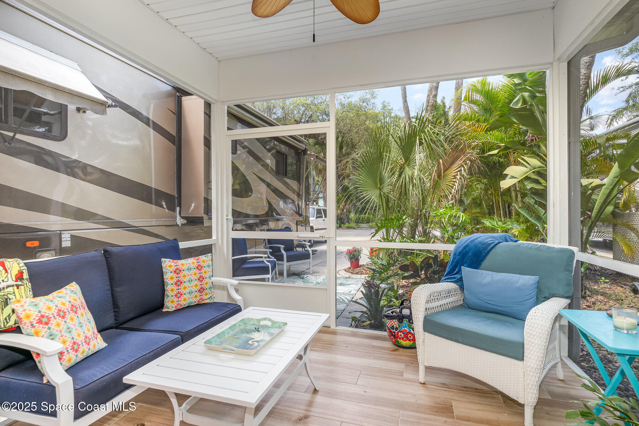 367 Oak Cove Road Titusville, FL 32780 - Photo 5 of 15 a living room with furniture and a floor to ceiling window