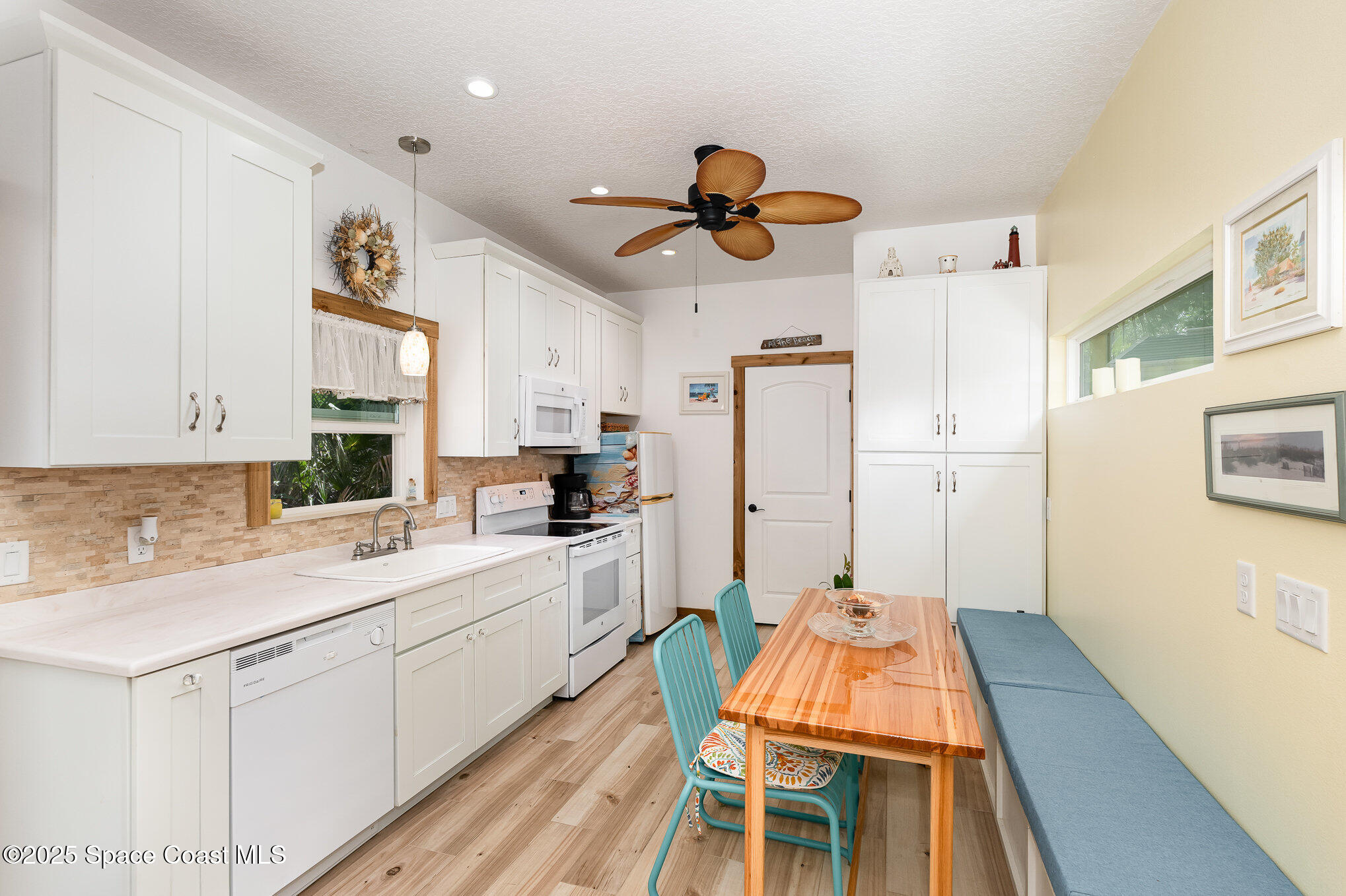 367 Oak Cove Road Titusville, FL 32780 - Photo 6 of 15 a kitchen with wooden cabinets and center island