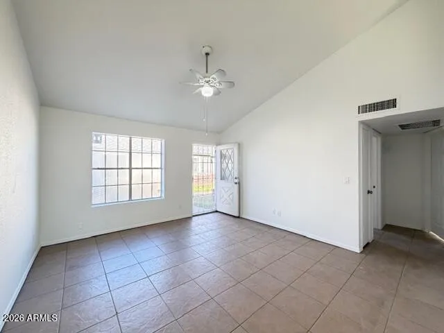 a view of an empty room with a window