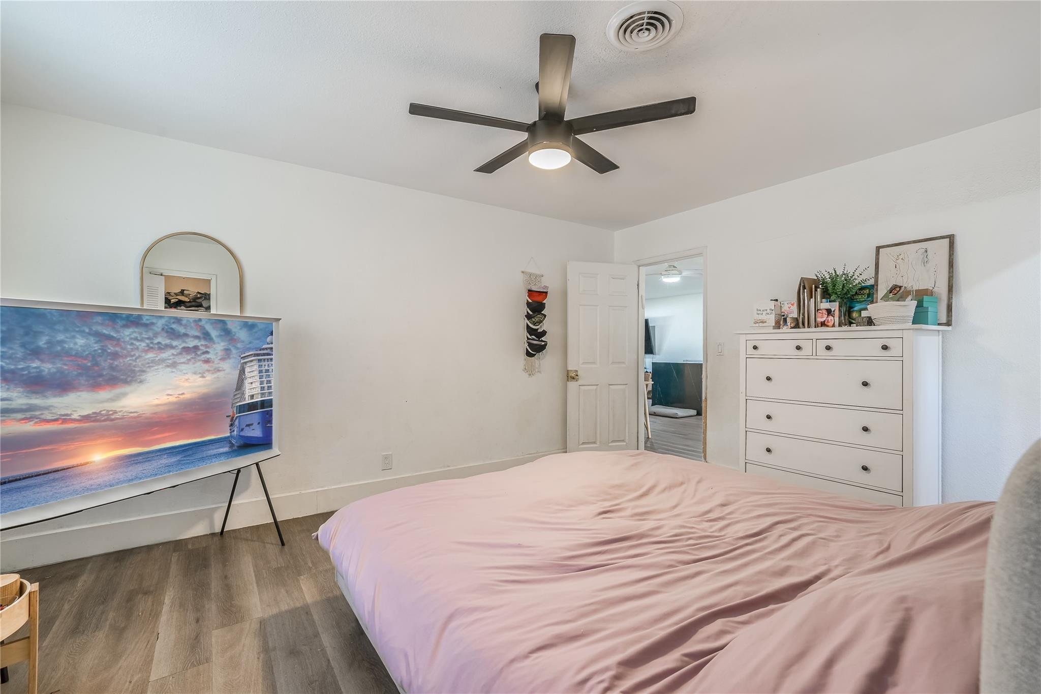 3193 Taft Street Hollywood, FL 33021 - Photo 8 of 20 a bedroom with a bed and a dresser