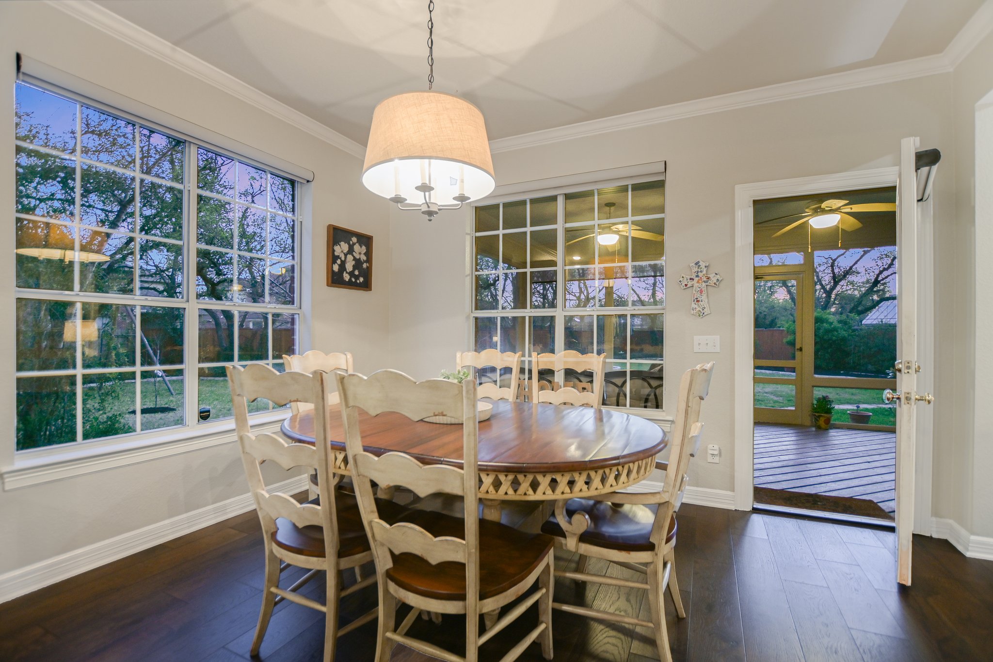 11100 Sheba Cove Austin, TX 78759 - Photo 12 of 29 a dining room with furniture a rug and wooden floor