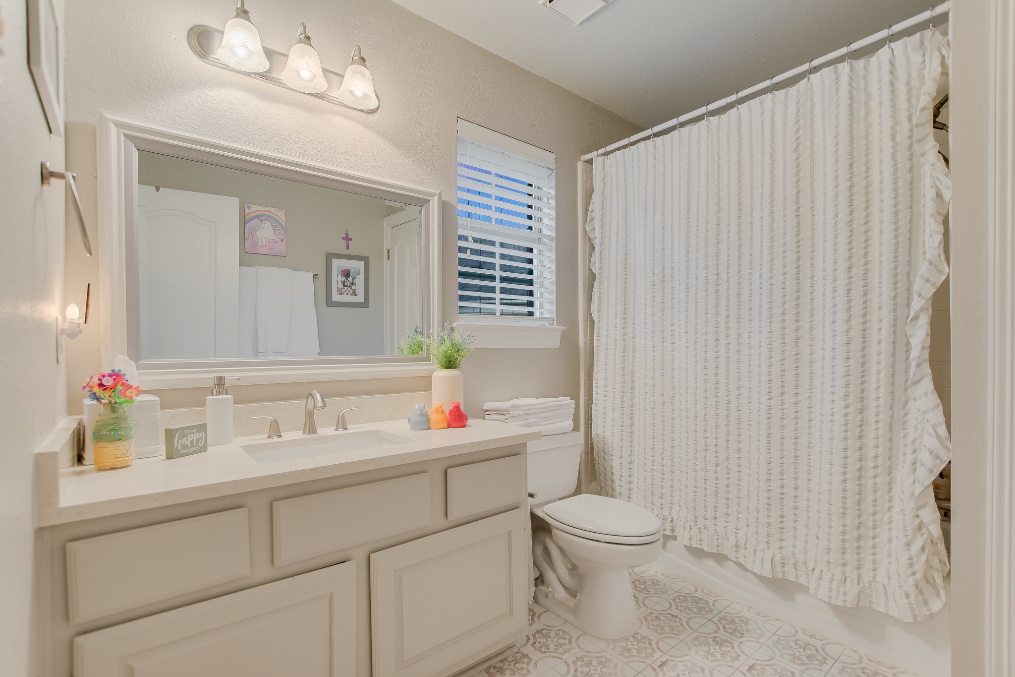 11100 Sheba Cove Austin, TX 78759 - Photo 16 of 29 a bathroom with a toilet sink and mirror