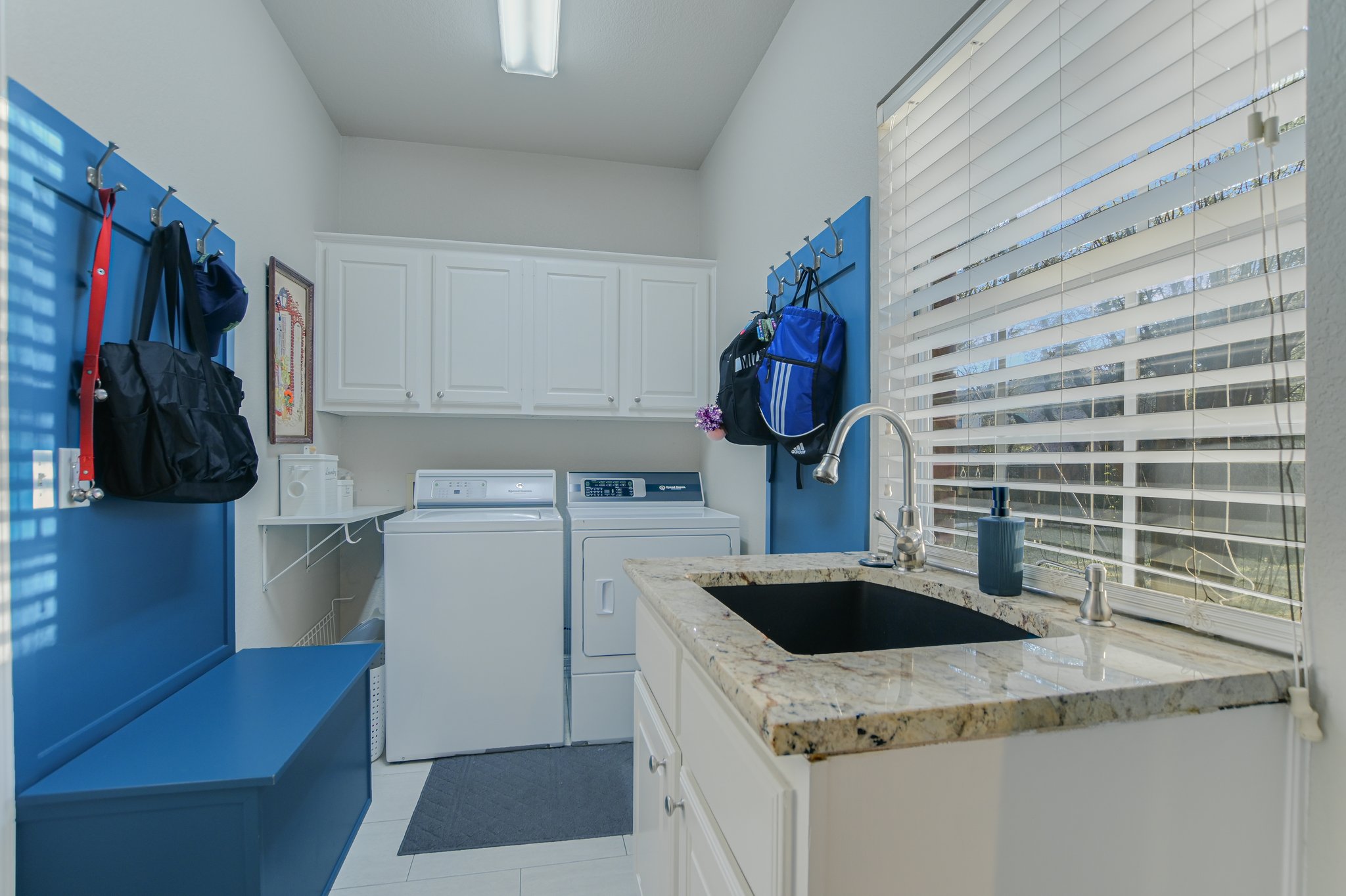 11100 Sheba Cove Austin, TX 78759 - Photo 18 of 29 a kitchen with a sink a stove and cabinets