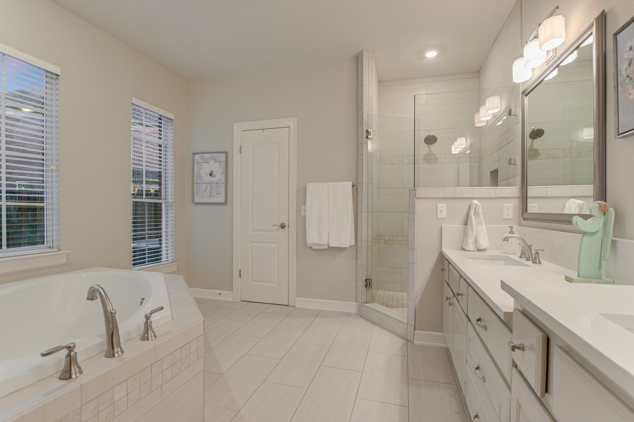 11100 Sheba Cove Austin, TX 78759 - Photo 20 of 29 a spacious bathroom with a double vanity sink mirror and double