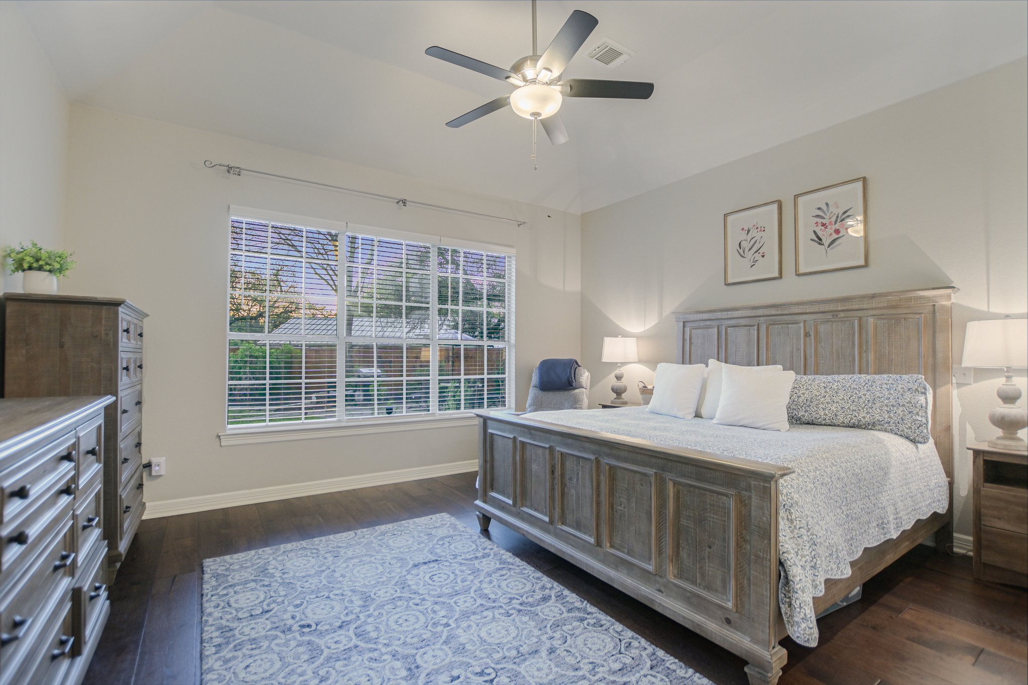 11100 Sheba Cove Austin, TX 78759 - Photo 6 of 29 a bedroom with a bed flat screen tv and a window