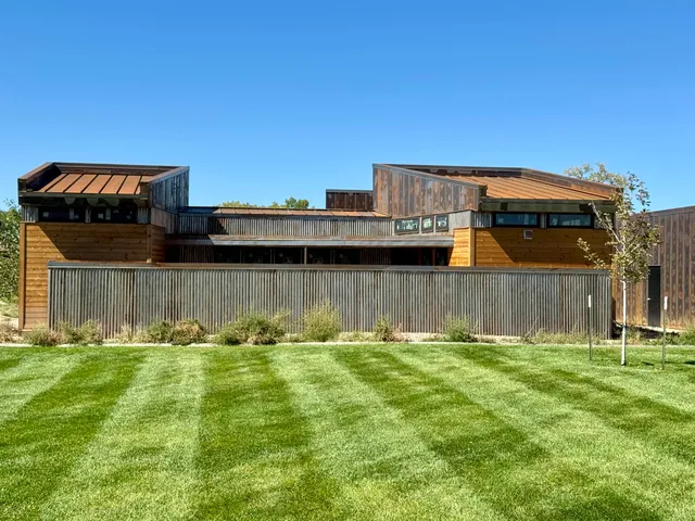 a swimming pool with outdoor seating