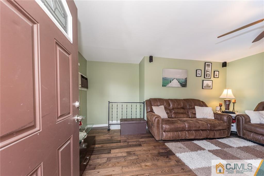 114 Dock Road Brick, NJ 08723 - Photo 3 of 25 a living room with furniture and a window