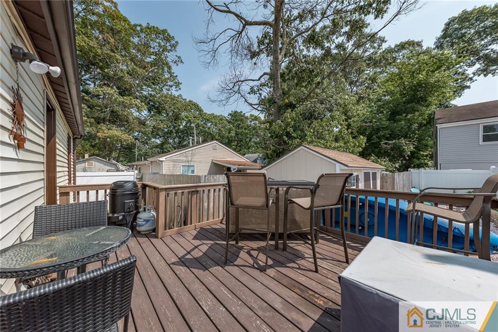 114 Dock Road Brick, NJ 08723 - Photo 22 of 25 a view of a house with wooden deck and furniture