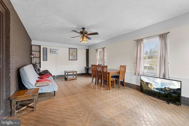 a bathroom with a granite countertop sink toilet and a mirror