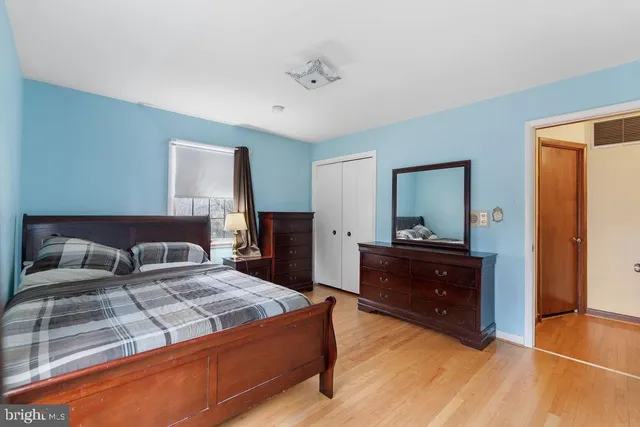 a bedroom with a bed and a cabinet