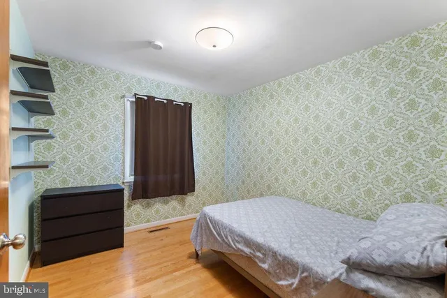 a bedroom with a bed and closet