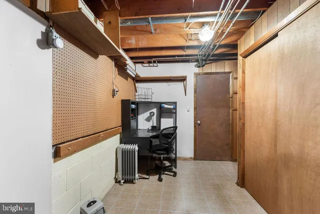 a bed room with furniture and a large window