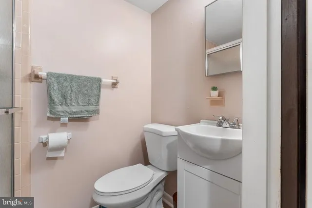 a bathroom with a glass shower door
